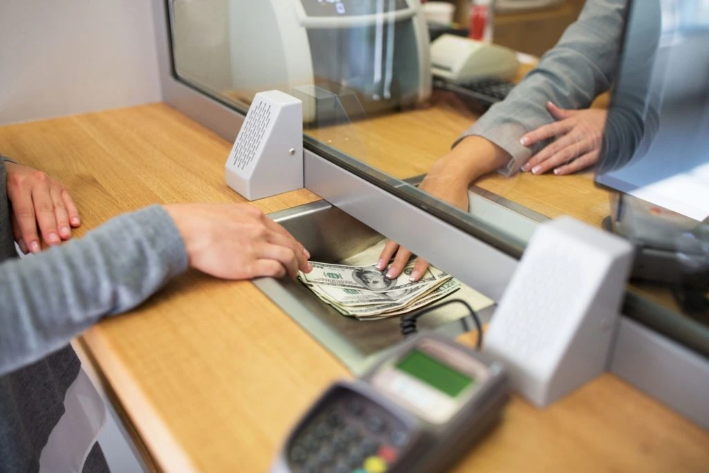 woman withdrawing money from the bank