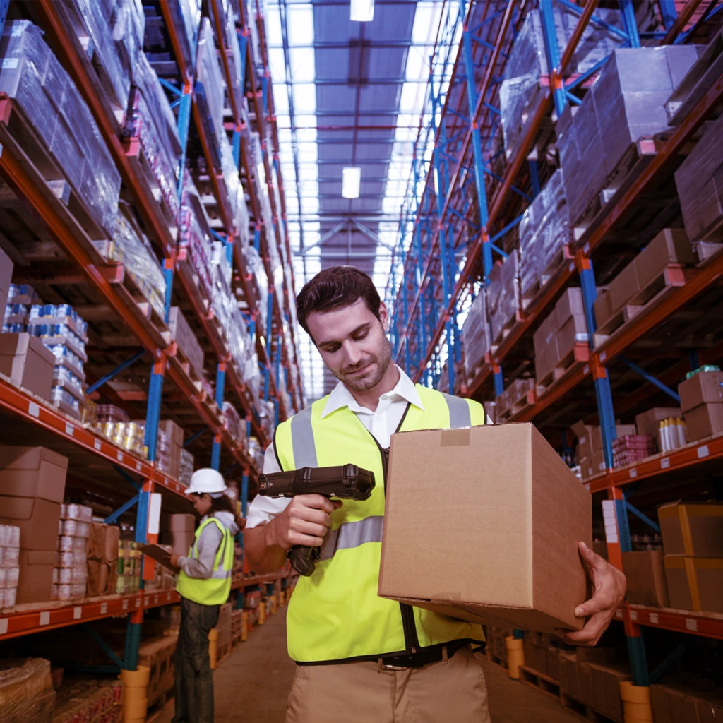 man wearing yellow safety vest in warehouse scanning a box barcode with a hand scanner
how to get transparency codes for amazon