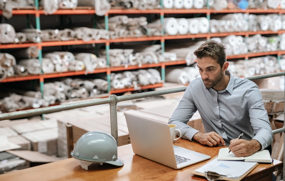 Amazon seller studying analytics and logistics in warehouse