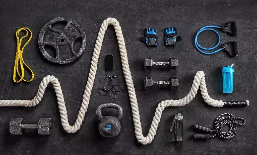 An assortment of fitness equipment on a black background